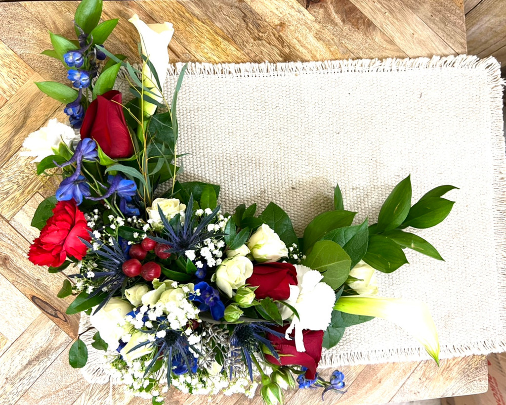 Elegant funeral casket décor designed to fit inside the corner of an open casket