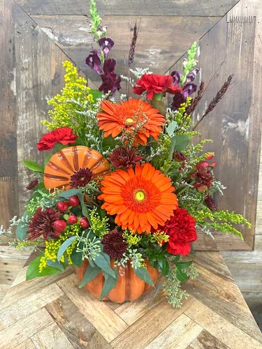 Pumpkin Spice fall flower arrangement in ceramic pumpkin