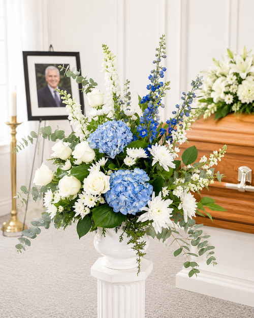 Elegant funeral pedestal flower arrangement displayed at a memorial service in Gilbertsville, PA