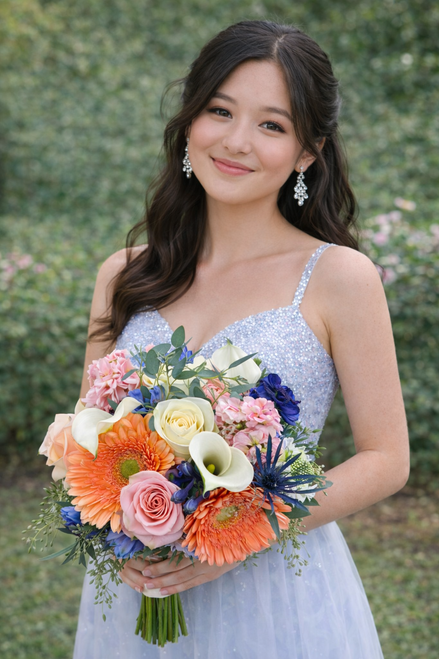 Premium calla lily and mixed flower prom bouquet with roses, gerbera daisies, seasonal flowers, and greenery.