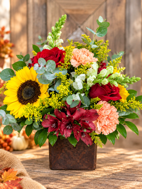 Fall Cube autumn flower arrangement with sunflowers, red roses, burgundy flowers and peach carnations