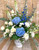 Wedding entrance pedestal flower arrangement with greenery