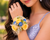 Fresh rose wristlet corsage detail showing ribbon and blooms