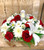 Angel memorial arrangement featuring a keepsake angel surrounded by fresh seasonal flowers and greenery, professionally designed as a personalized sympathy tribute by Wendy's Flowers in Pennsylvania.