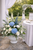 Wedding pedestal floral arrangement with hydrangea and roses for ceremony décor