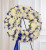 Traditional standing funeral wreath with red and white flowers available for local delivery in Gilbertsville, PA