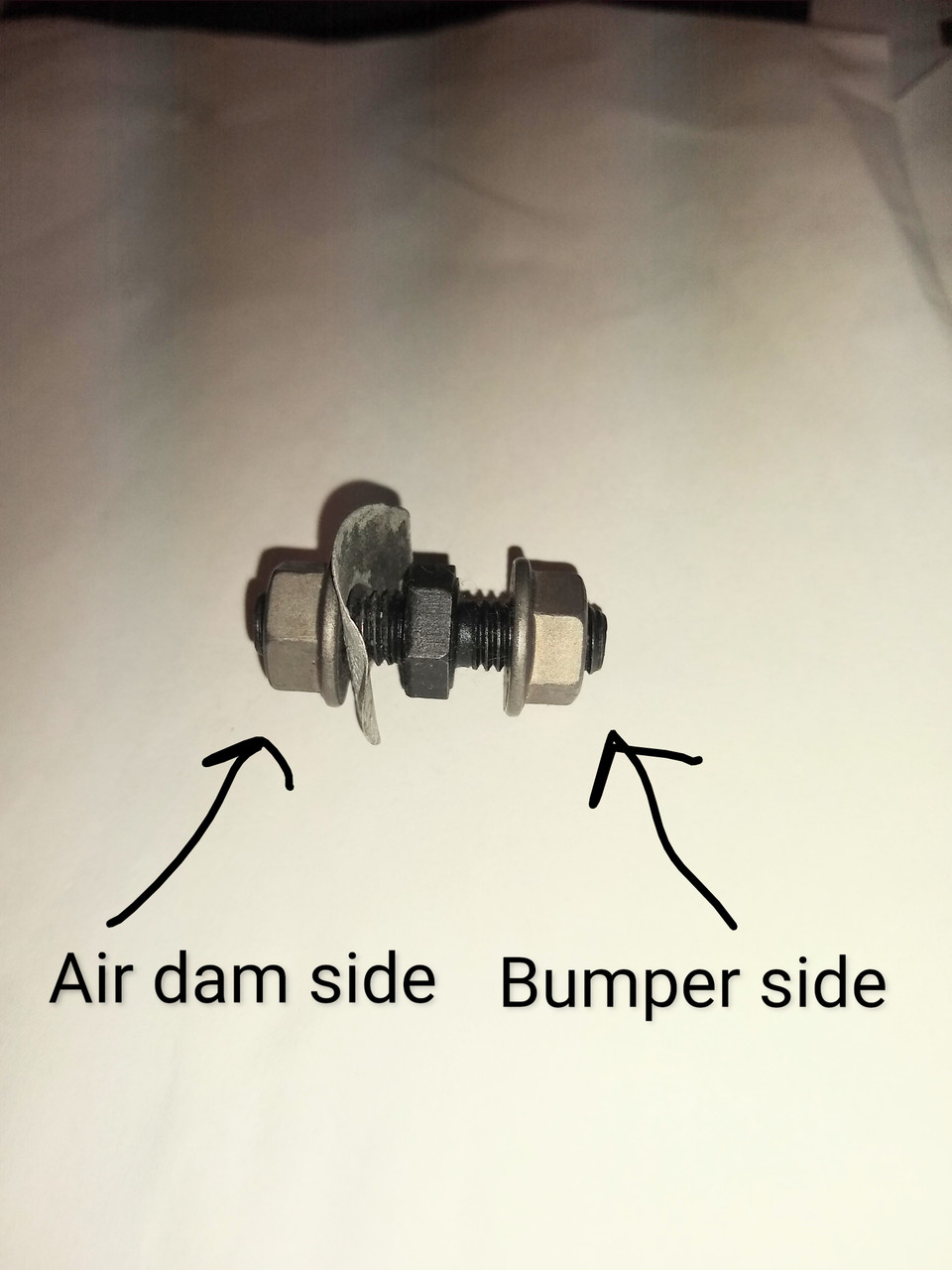 Air dam stud with flange nuts and spring steel washer assembled on stud Air dam stud with flange nuts and spring steel washer assembled on stud