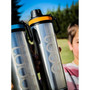 Single wall open-ended water bottle with black silicone band and neoprene insulating sleeve