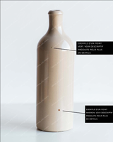 Bouteille pour huile d'olive en grès beige, annotée pour montrer un exemple de point vert et un exemple de point marron dans l'émail