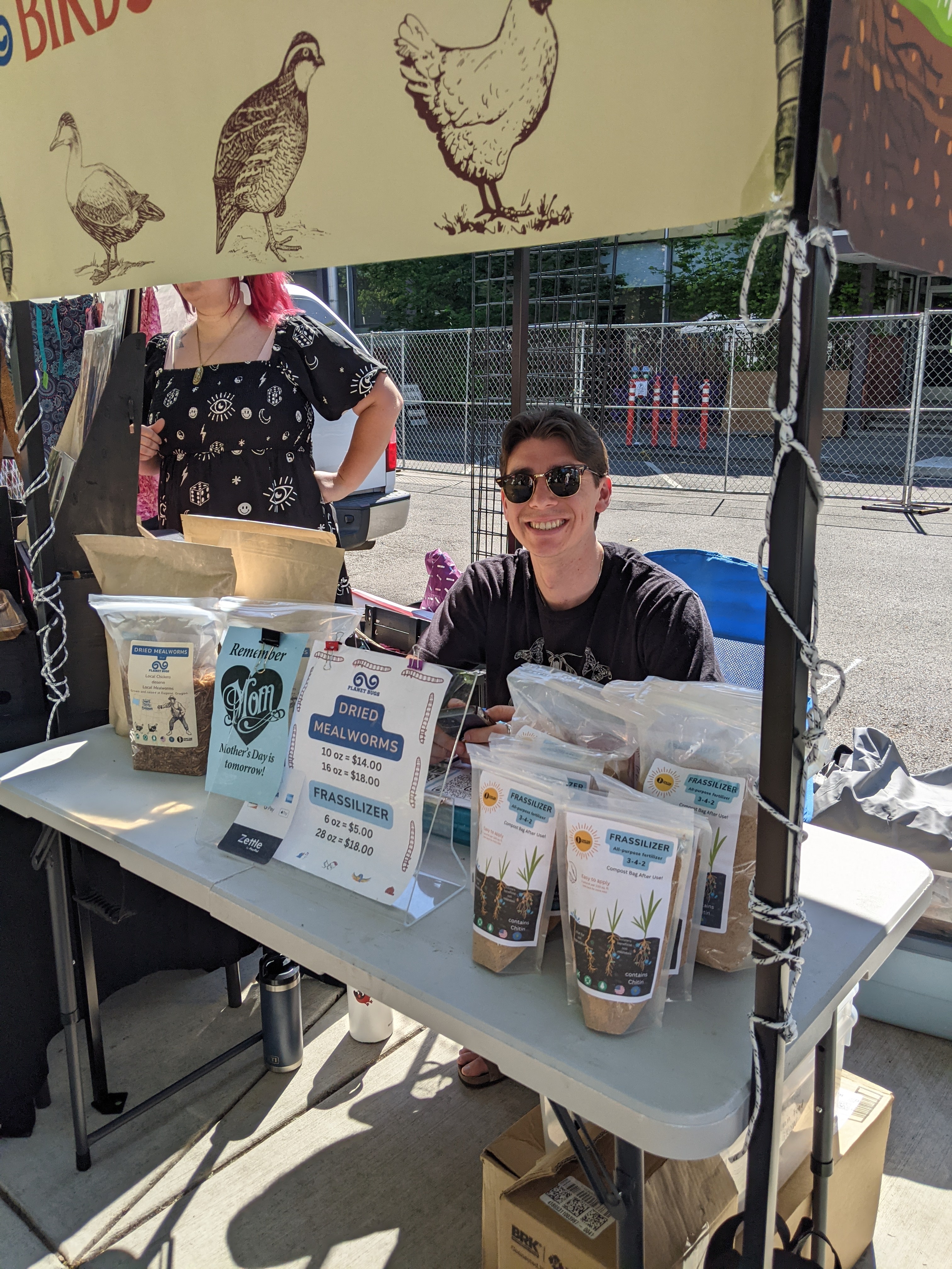Co-Founder Brenden Campbell selling dried mealworms and frassilizer fertilizer at the Eugene Saturday Market