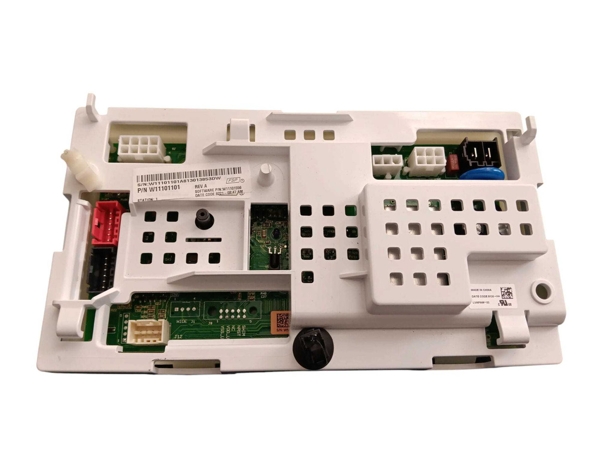 The Whirlpool Washer Main Control Board (model W11101101) is a rectangular electronic circuit board housed within a protective casing. The casing is typically a durable plastic, often in a light gray or white color, designed to protect the internal electronic components. The control board itself is a green or blue printed circuit board (PCB) with various small electronic components like capacitors, resistors, relays, and integrated circuits (ICs) mounted on it.