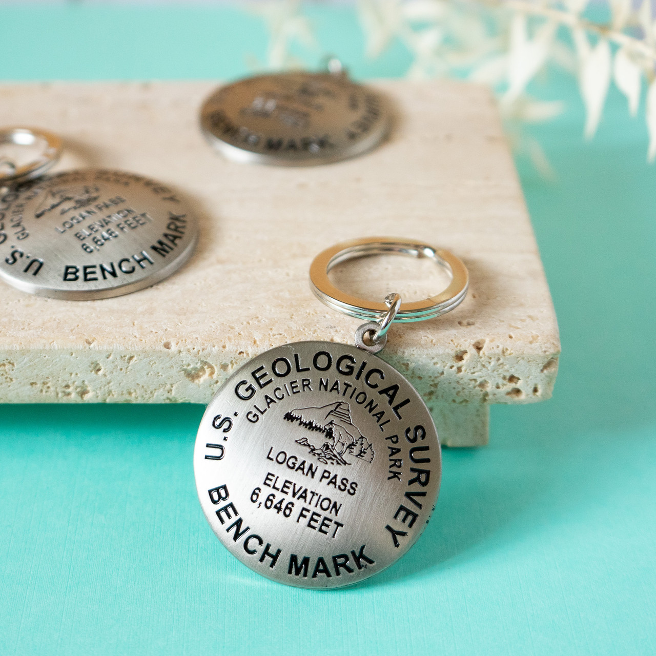 Logan Pass Benchmark Keychain Glacier National Park Conservancy