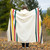 This blanket is ivory with classic Pendleton stripes and fringe around the outside edge.