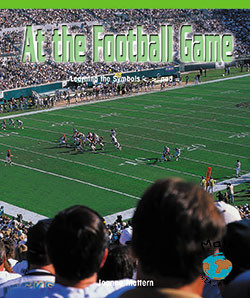 At the Football Game (Learning the Symbols <, >, and =) - 9780823988754 by Joanne Mattern, 9780823988754