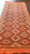 Angled, top facing image of  Vintage Moroccan runner, showing a dimensional view of the rug in a hallway.