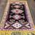 Angled, top facing image of  vintage Moroccan rug, showing a dimensional view of the rug