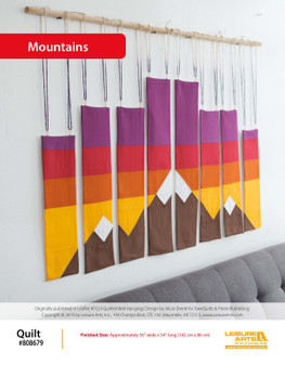 Bring a rocky mountain adventure home as you quilt this beautiful color blocked Mountain Wall Hanging! Created by Alicia Steele from FaveQuilts, this pattern is meant to bring some rustic charm with bold hues and ombre backdrops. This pattern comes from our leaflet Quilted Wall Hangings, Item 7494.