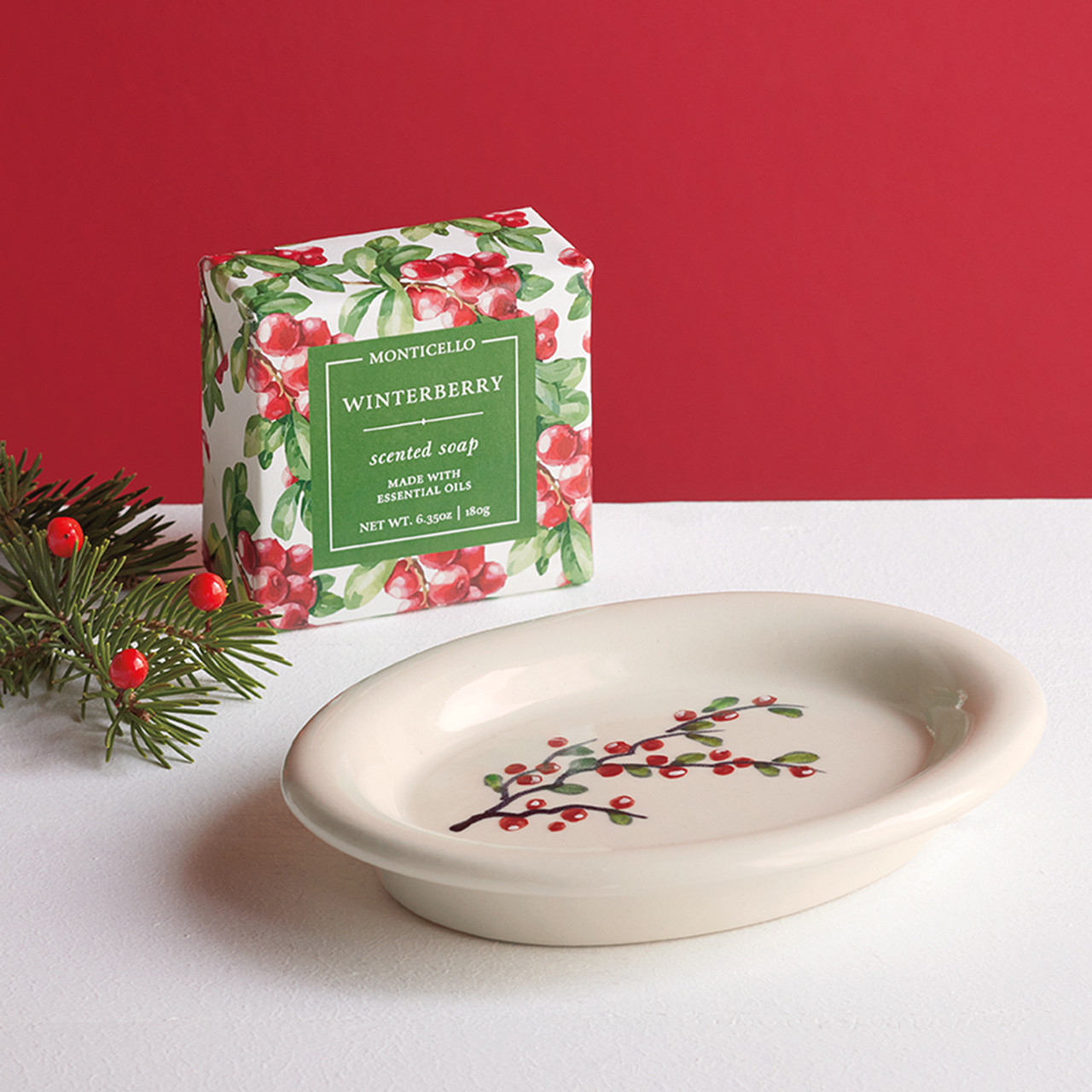 Ceramic dish with winter berry decoration and bar of soap