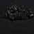 Black rubber double rattle bands for fishing lure skirts arranged on a black cloth background.