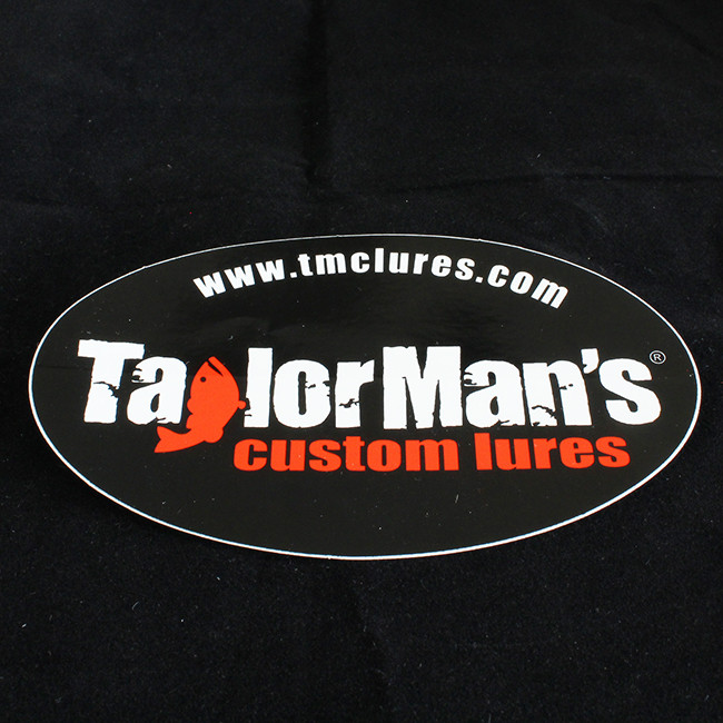 Taylor Man's black oval vinyl stickers measuring 3 by 5 inches with Taylor Man's logo