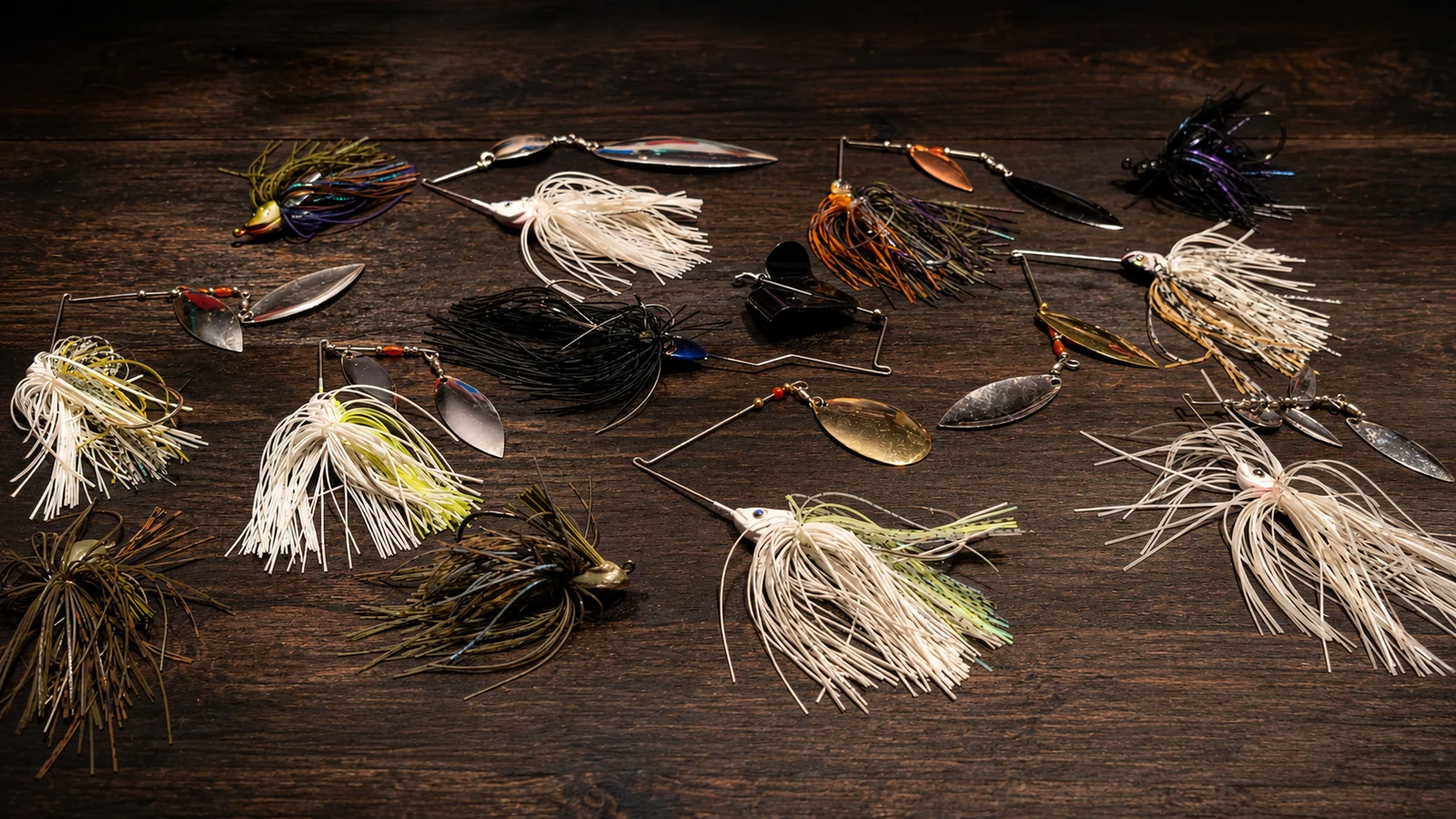 Selection of Taylor Man's spinnerbaits and other hand-built lures on a wood surface