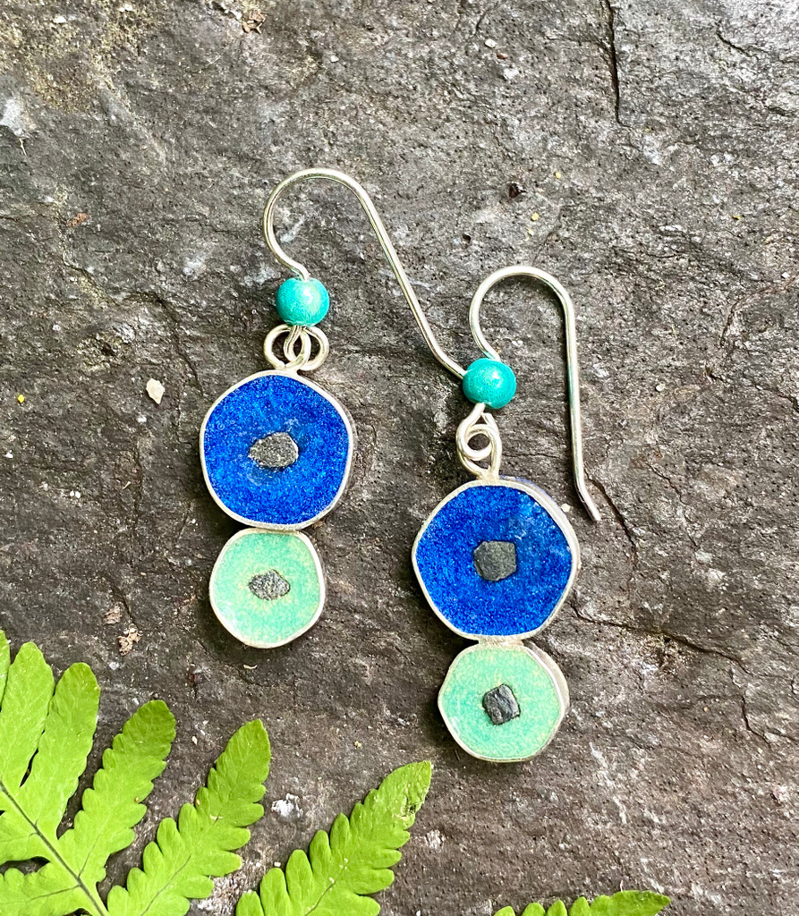 These Stepping Stone Earrings represent moving in the right direction. They are handcrafted from Sterling silver and colored with tinted resins. They are further embellished with small mountain-top stones. Their size is 1/2" x 1", not including their Sterling earring wires. They are the perfect gift for a friend or for you!