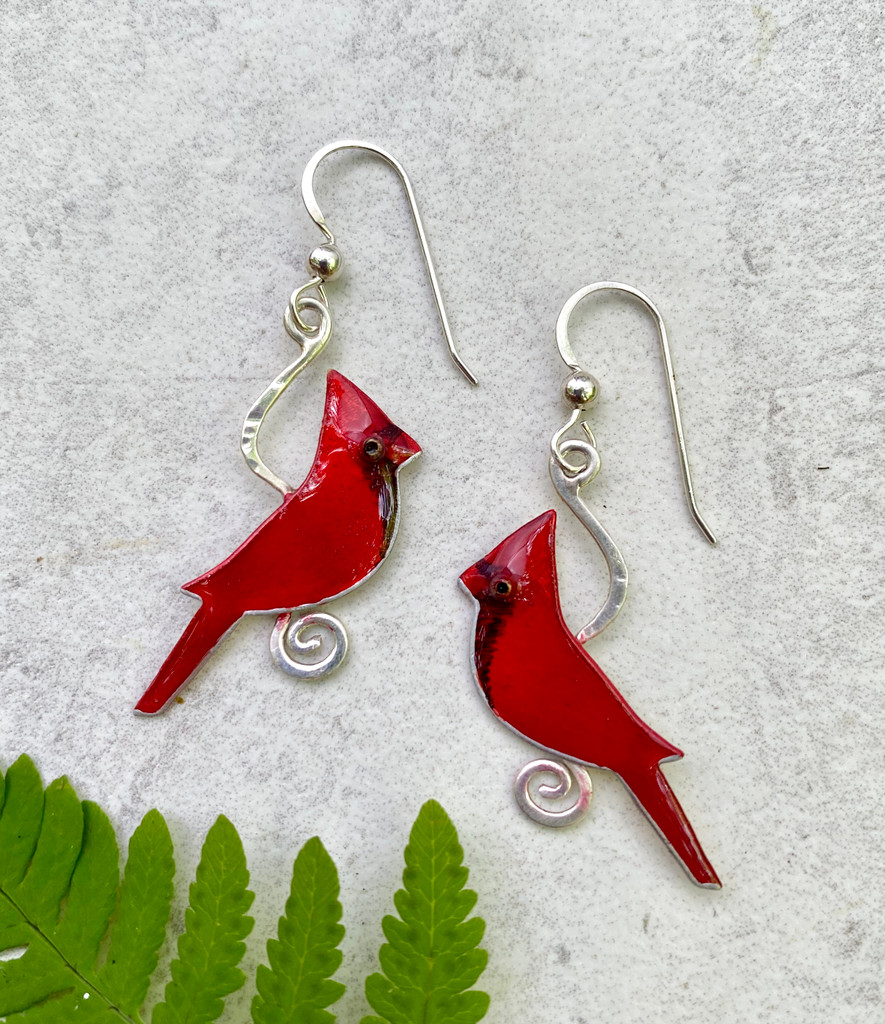 You can't miss the flash of a cardinal, and these Cardinal Earrings are a reminder of what a thrill it is to see one. They are handcrafted from Sterling silver and jeweler's brass, and then carefully hand-painted. They measure 7/8" x 1 1/8", and are light as a feather.