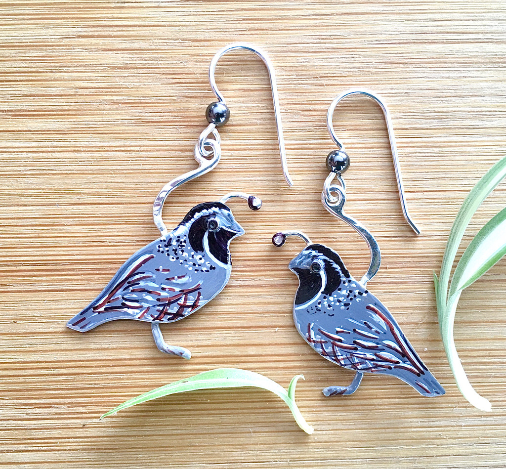 Who doesn’t love the sight of a quail, with its inquisitive nature and amusing gait? These earrings are both a reminder of and a tribute to this wonderful bird. I make them out of Sterling and jeweler’s brass, and carefully handpaint each one. They are sealed with jeweler’s resin for durability. They measure 1” wide x 1 1/4” tall, not including the Sterling earring wires. They are light and comfortable, and fun to give and to wear!