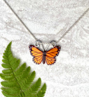 Monarchs and their migration are yet another marvel of the natural world. This Monarch Butterfly Necklace is a tribute to their beauty and fortitude. It is handcrafted from jeweler's brass and Sterling silver, and then carefully handpainted, and finished with a coat of protective resin. The butterfly measures 1" wide by 3/4" tall and is strung on a 16" chain. It would also work on an 18" chain. If you would prefer the longer one, let me know in the notes. 