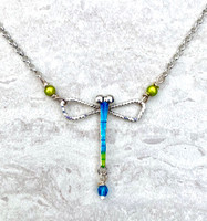 Damselfly or dragonfly? This necklace could be a tribute to either, but leans towards a damselfly, with its slender body. It is handmade out of Sterling silver and colored with tinted reflective resins. It measures 1 1/4" tall by 1" wide and floats on a Sterling chain that is 18" long. It is the perfect gift for anyone who would rather be outside!