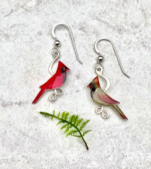 Because wearing these cardinal earrings is as special as seeing one...These Small Cardinal Earrings feature male and female cardinals. They are handcrafted from jeweler's brass and Sterling silver, and then carefully handpainted. They measure 3/4" x 7/8" and are as light as a feather.