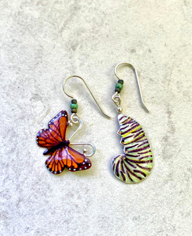 One of the seven natural wonders of the world is the monarch butterfly migration. Both the individual monarch butterfly and its caterpillar stage are critical components of this miracle on earth. These earrings pay homage to both phases of the monarch's existence. I make them both out of jeweler's brass and Sterling and carefully hand-color each one, finishing them with jeweler's resin for depth and durability. They measure 7/8" wide x 1" tall, not including the earring wires. They are light and fun to give and to wear. 
