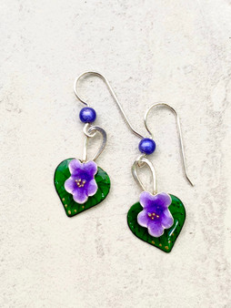 Everyone loves violets and these earrings are a reminder of this. They are carefully handcrafted out of Sterling and jeweler's brass and meticulously hand-colored. They measure 3/4" tall by 1/2" wide, not including the Sterling earring wires. They are light to wear, and would be the perfect gift for a friend or you!
