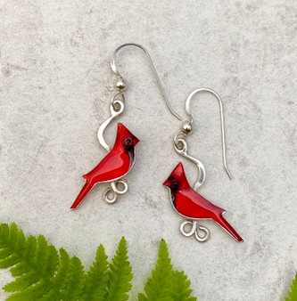 Because wearing these cardinal earrings is as special as seeing one...These Small Cardinal Earrings feature two male cardinals. They are handcrafted from jeweler's brass and Sterling silver, and then carefully handpainted. They measure 3/4" x 7/8", not including the Sterling earring wires, and are as light as a feather.