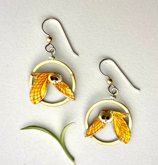The sight of an owl is always a treat, and barn owls are no exception. These earrings are a tribute to a very cool bird that nests in barns (surprise) as well as dense forests. I make them out of Sterling and brass, and carefully handpaint them, finishing them with a protective coat of resin. They measure 3/4" wide by 1" tall, not including their Sterling earring wires. 