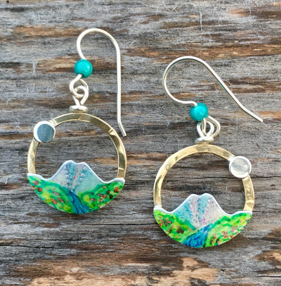 John Muir’s quote, “The Mountains are calling and I must go”, resonates with all of us, and these mountain earrings will too. They are a tribute to the beauty and sanctity of our earth’s mountains. They measure 3/4” in diameter and are light to wear.