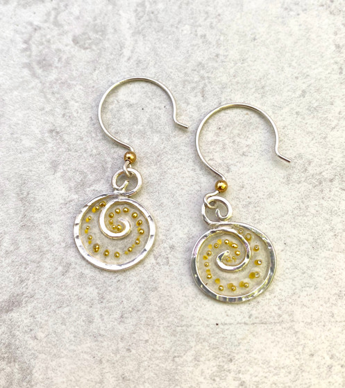 We can all use a lift from time to time, and these Lighter Than Air Earrings provide just that; a touch of the ethereal. They are hand crafted from Sterling silver and have translucency that supports golden accents. They literally float when worn and add a bit of subtle sparkle. They measure 5/8" wide by 3/4" tall, not including the Sterling earring wires. They are light and comfortable to wear and are the perfect gift for a friend or for you!