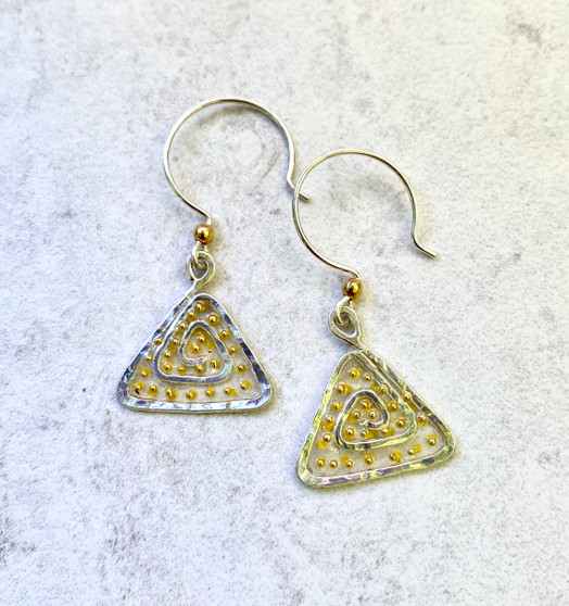 We can all use a lift from time to time these Lighter Than Air Earrings provide just that; a touch of the ethereal. They are handcrafted from Sterling silver feature translucency (what a great word and concept!) that supports golden accents. They literally float when worn and add a bit of subtle sparkle. They measure 3/4" wide by 3/4" tall, not including their Sterling earring wires. They are light and fun to wear and make the perfect gift for a friend or you!