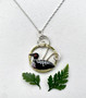 This Loon Necklace celebrates the comeback of the loon. Even with their numbers increasing, the sight of a loon is always awe-inspiring. This necklace serves as a reminder of this. It is handcrafted out of Sterling and jeweler's brass, and carefully hand-colored and sealed with jewelry-grade resin. The pendant measures 1" tall x 3/4" wide and is suspended on an 18" Sterling chain. 