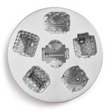 Inside view of the Cozy Village Pan. Inside of pan is silver in color and shows six small house shaped wells.