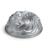 Let it Snow Bundt Pan from side. Silver color tube shaped pan with swirling snowflakes.