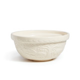 White earthenware bowl with embossed image of  pig in front of sun, trees.