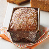 Pumpkin bread baked in the bakeable paper loaf pan. Light dusting of sparkling sugar on top.