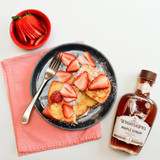 Whistle Pig Rye Whiskey Barrel-aged Maple Syrup with pancakes and strawberries