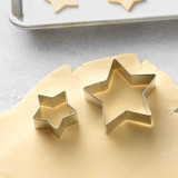 Star Cookie Cutters on rolled out sugar cookie dough