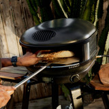 Arc Pizza Oven with pizza on a peel