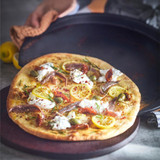 Pizza being cooked on Emile Henry Pizza Station