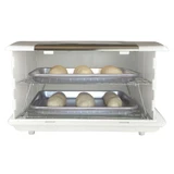 Looking inside Folding Bread Proofer  with two shelves and pans with rolls.