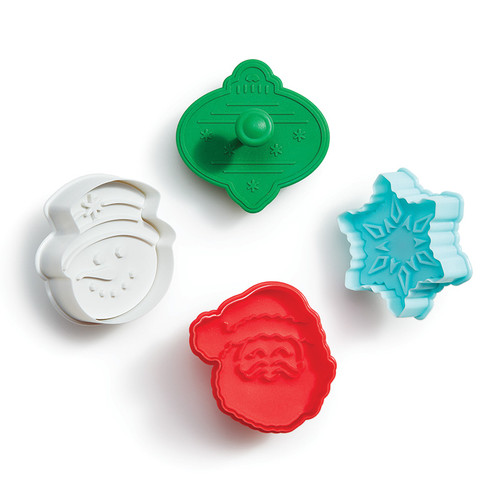 Christmas Pop Out Cookie Cutters including blue snowflake, red Santa, white snowman, and green ornament.