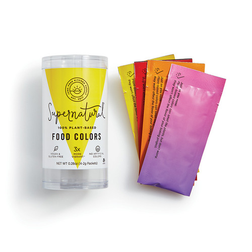 Plant-Based Food Colors package with color packs outside including Pomegranate Red, Yellow, Orange, and Magic Blackberry individual packages.